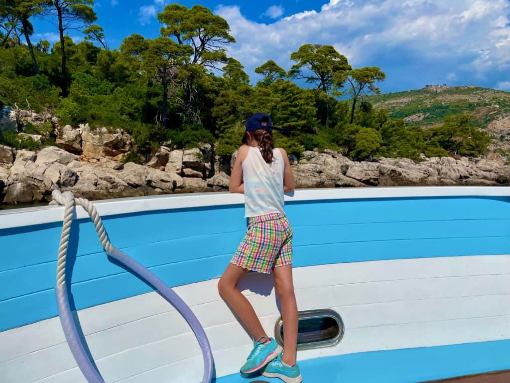 Dubrovnik with kids: Girl looking over the side of a boat