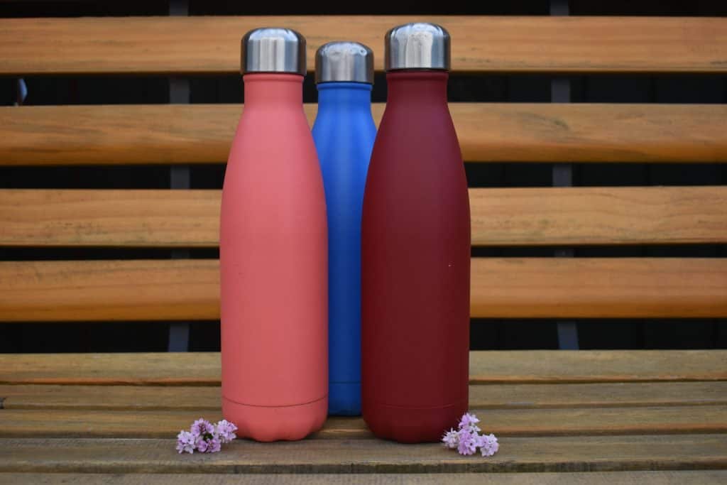 Chilly's water bottles on a bench