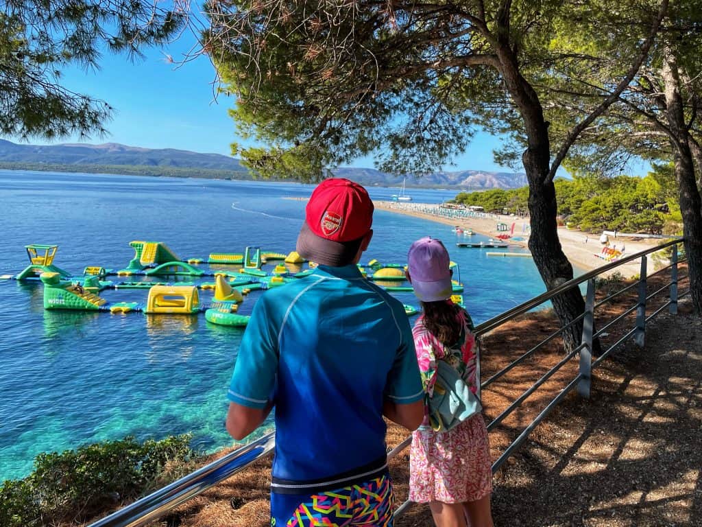 Family holiday in Croatia: Two children overlooking Zlatni Rat beach in Croatia