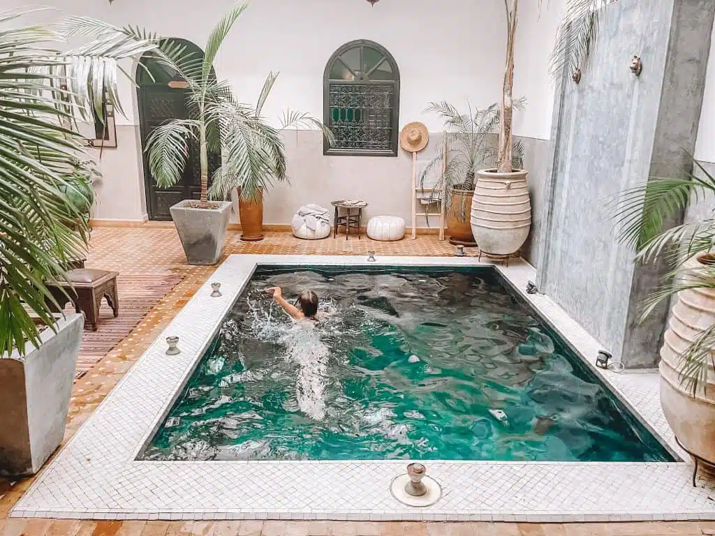 Child in a pool at a riad in Marrakech