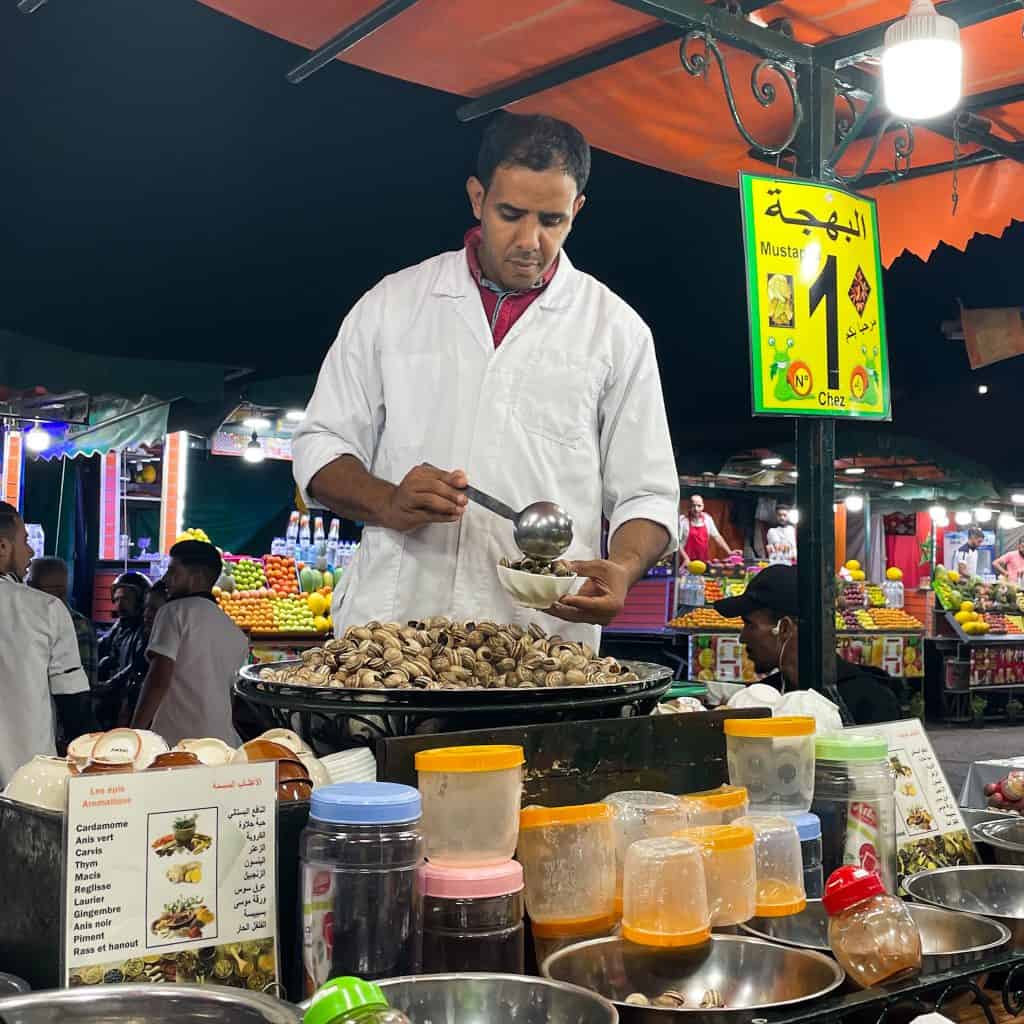 Man serving snails at a food stall in Marrakech