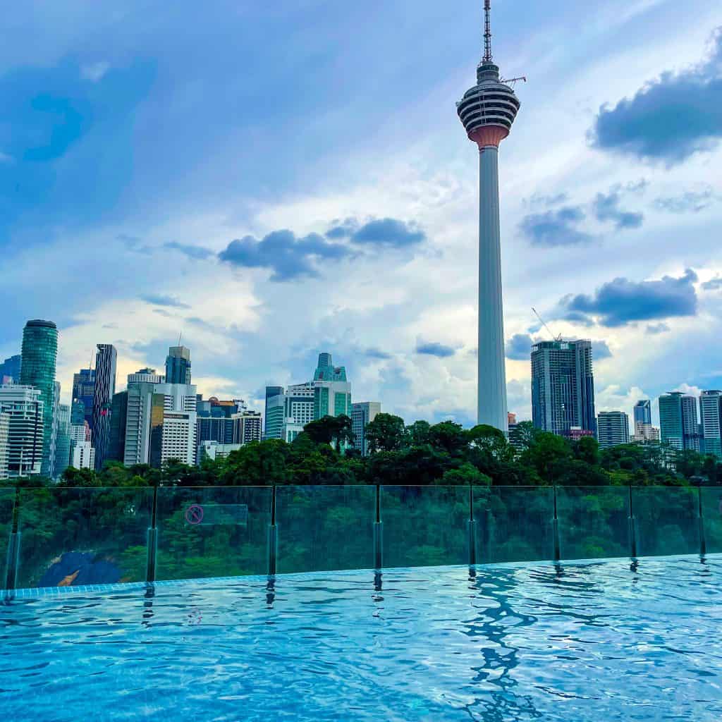 The KL Tower in Kuala Lumpur with a swimming pool in the foreground