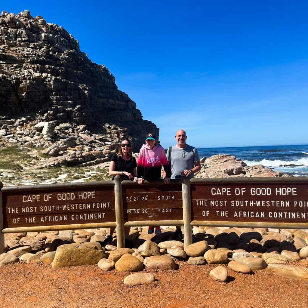 Having a picture taken at the Cape of Good Hope sign 