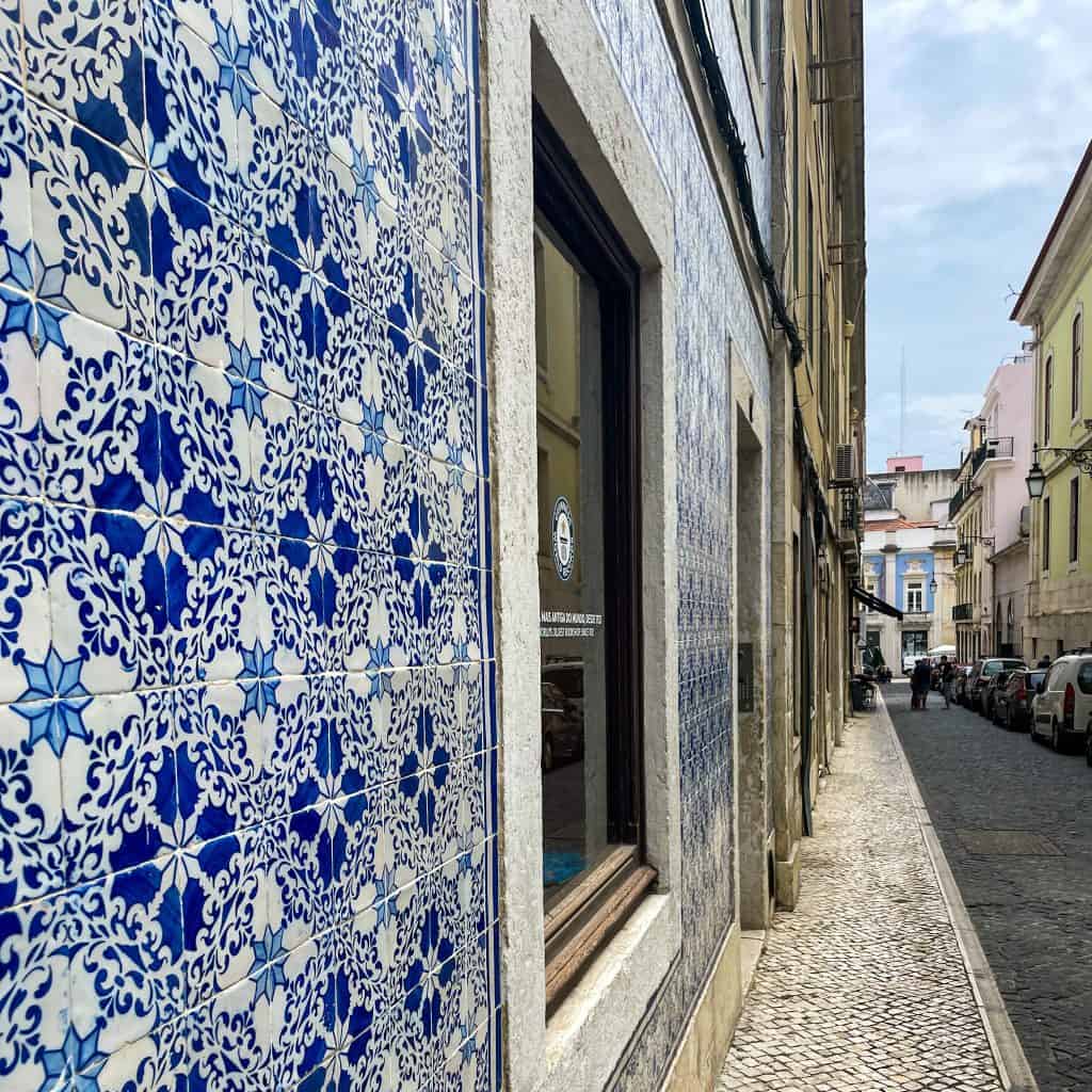 Blue and white tiles on a building on a Lisbon street