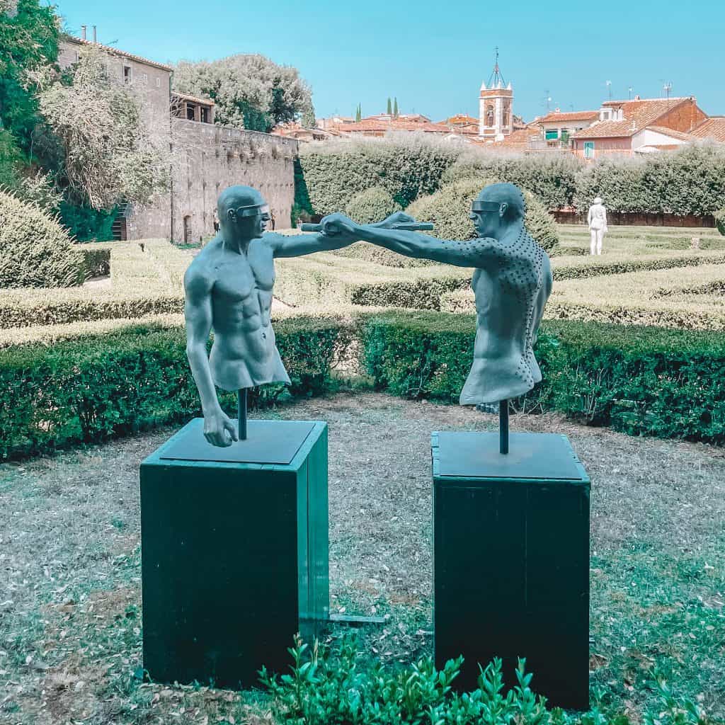 Statues of two males fighting