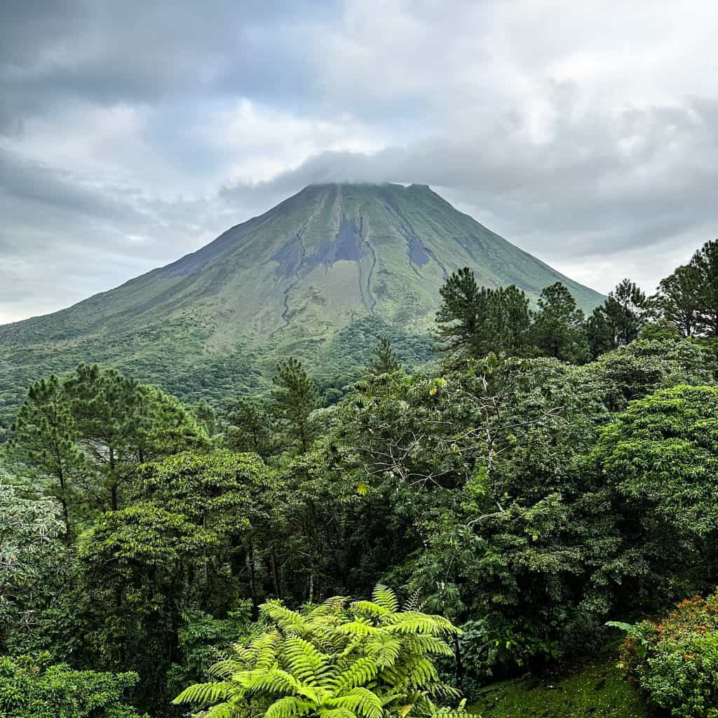Arenal Volcano Costa Rica with clouds above it