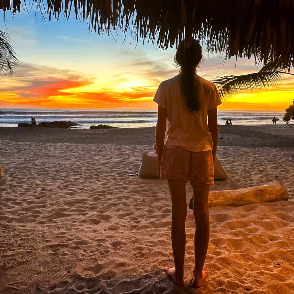 Girl looking at the sunset in Santa Teresa Costa Rica