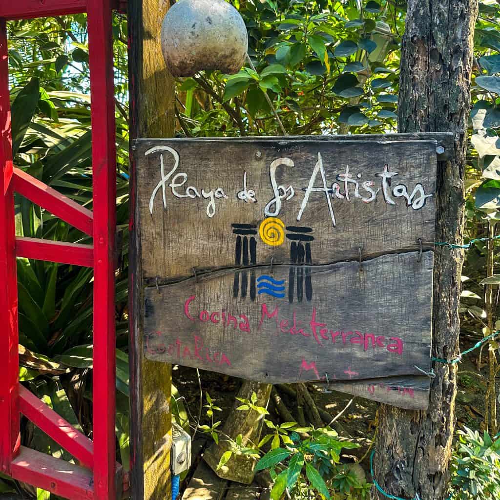 Sign for Playa De Los Artisitas restaurant in Montezuma Costa Rica