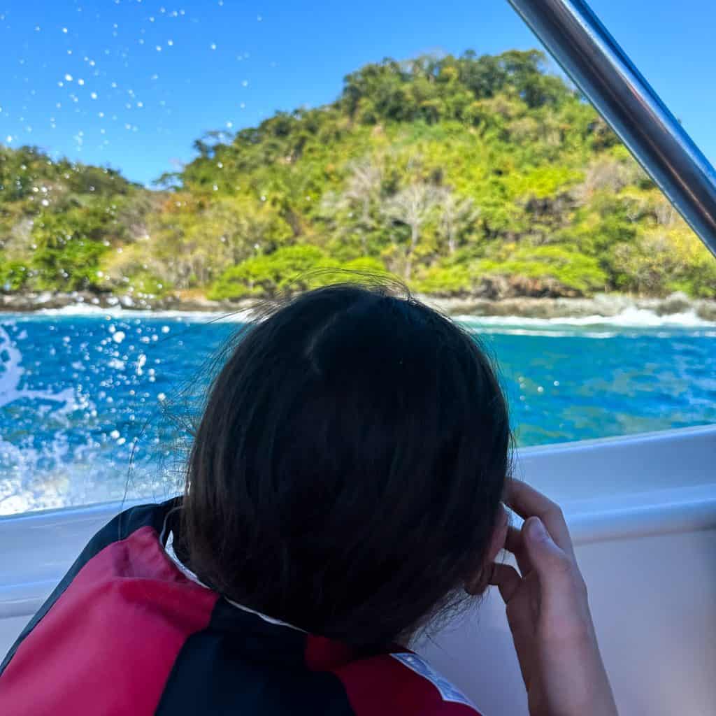 Girl looking out from a boat on a Tortuga Island Tour Costa Rica