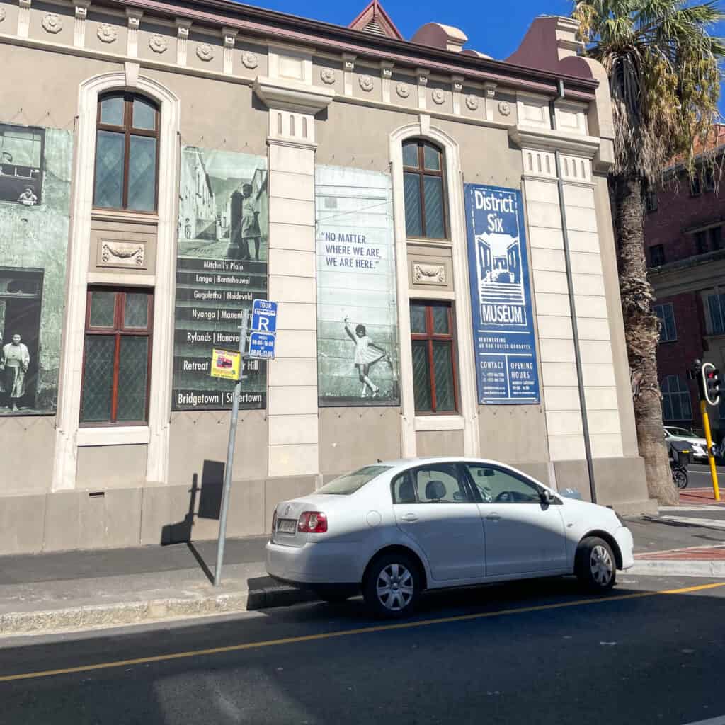 White car parked outside District 6 Museum