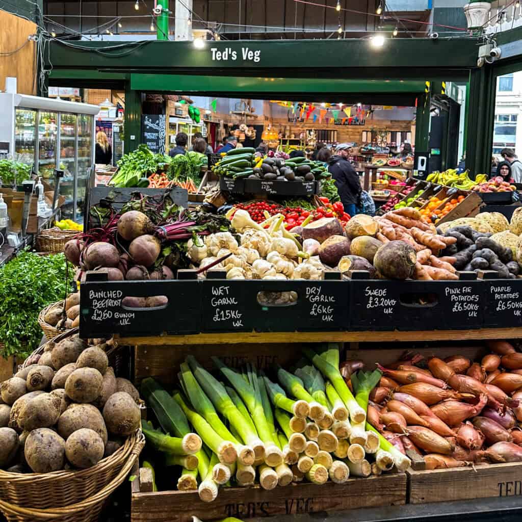 Fruit and vegetable stall at Borough Market with 'Ted's Veg' sign above