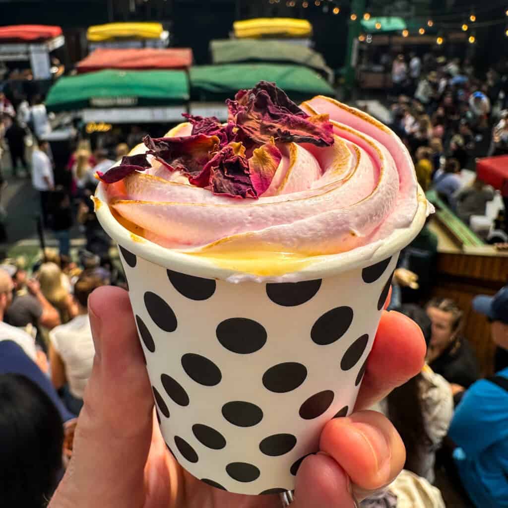 Dessert pot with toasted marshmallow and rose petals on top