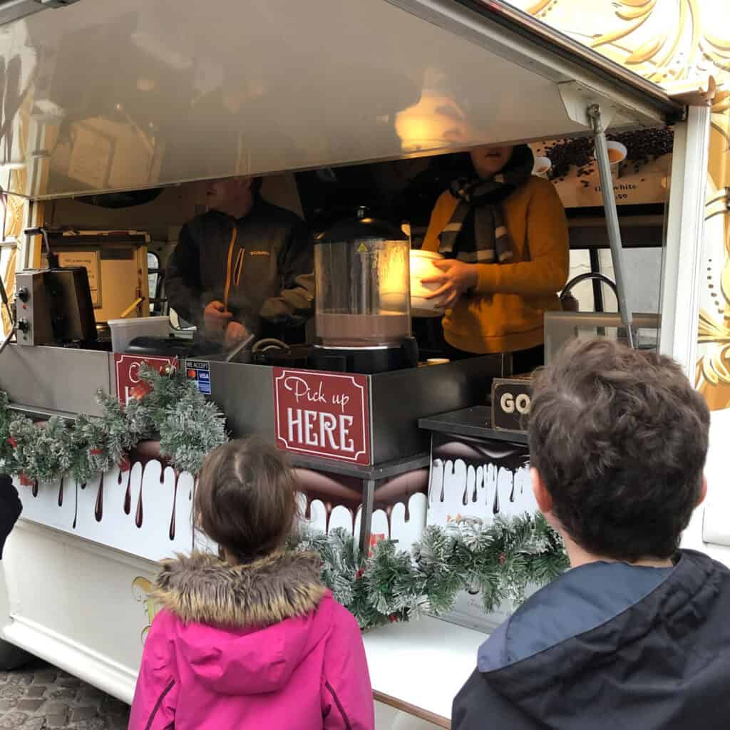 Children waiting in line at a waffle van