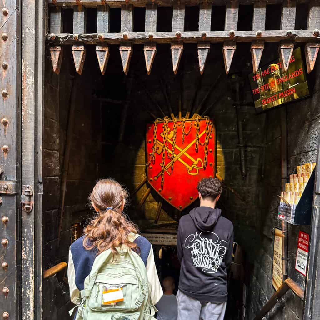 Two teens entering the Clink Prison Museum