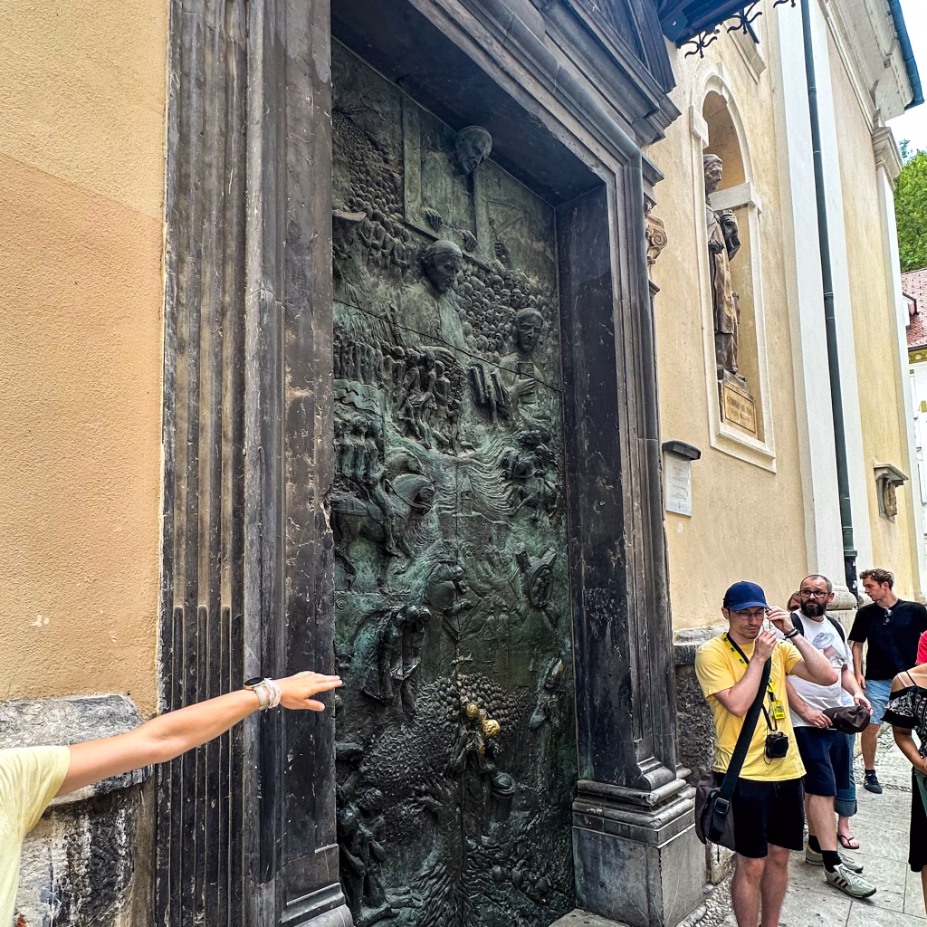 Large bronze door with carvings on a cathedral