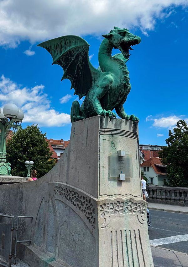 Green dragon on pillar on bridge