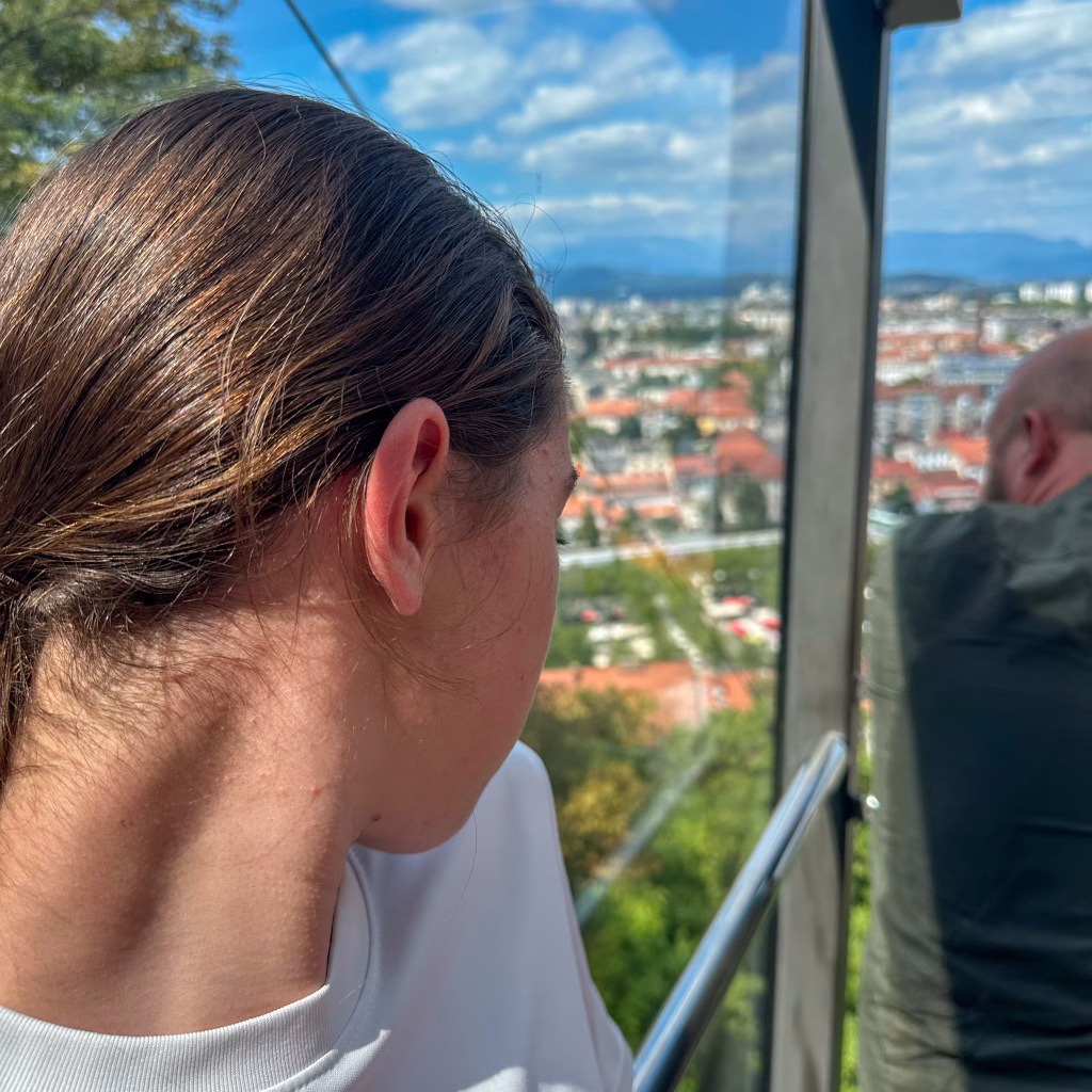 Girl in a cable car looking out at the view